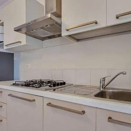 Apartman Modern Flat With A Fenced Garden And Fireplace Bibione