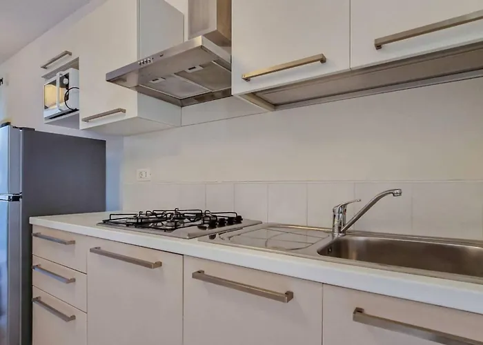 Apartman Modern Flat With A Fenced Garden And Fireplace Bibione